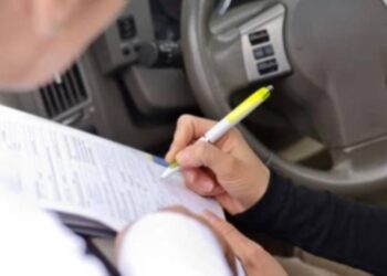 Student caught cheating board paper in car