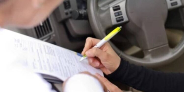Student caught cheating board paper in car